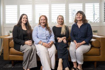 Four female property consultants